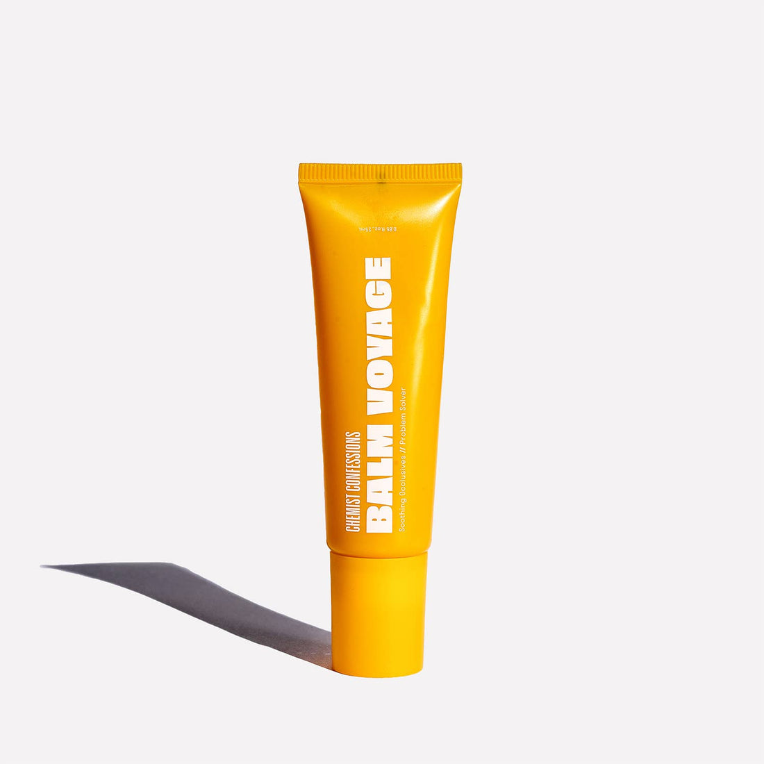 Chemist Confessions Balm Voyage, a wax, butter and oil formula blend in a yellow tube.