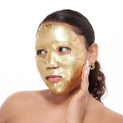 Woman wearing a gold Facetory sheet mask