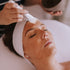 A person receiving a facial treatment at Kate O&